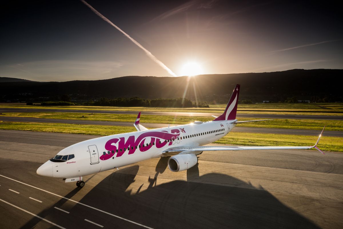 Swoop Airlines commercial advertising photograph on tarmac at CYLW Kelowna