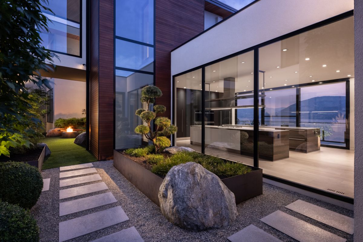 Luxury home exterior courtyard at dusk by Shawn Talbot