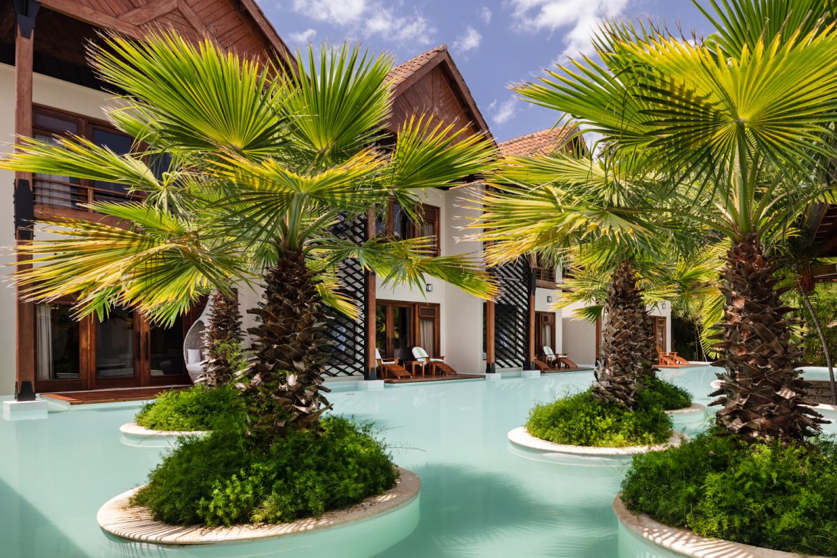 Caribbean resort hotel pool with palm trees
