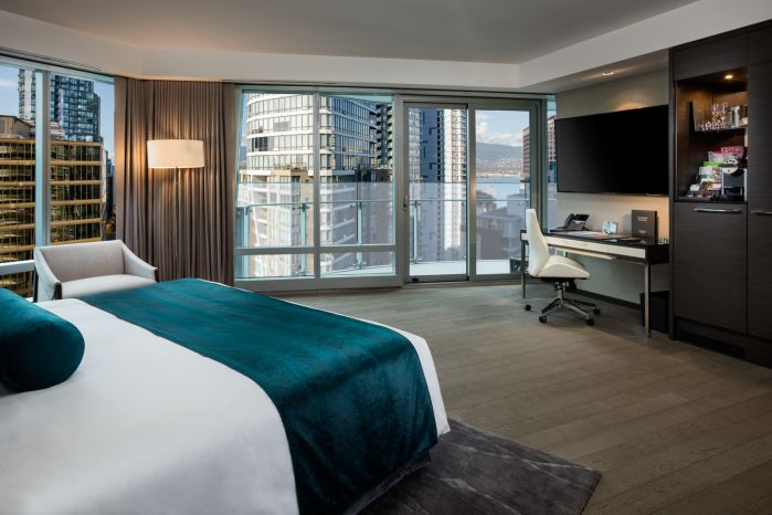 Trump Hotel Vancouver architectural room interior over bed to view of downtown