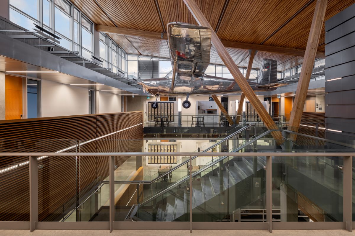 Okanagan College architectural interior plane hanging from ceiling above staircase