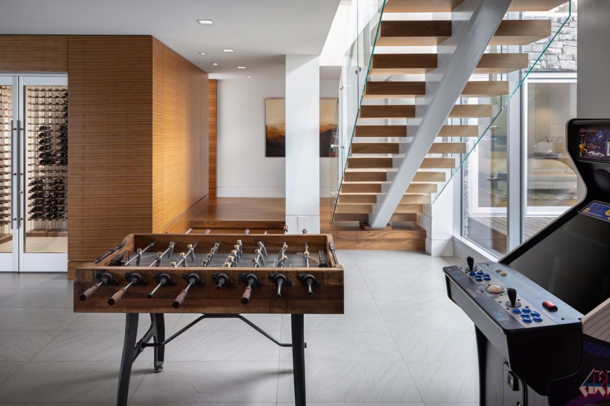 Residential architectural interior of games and wine room in contemporary home