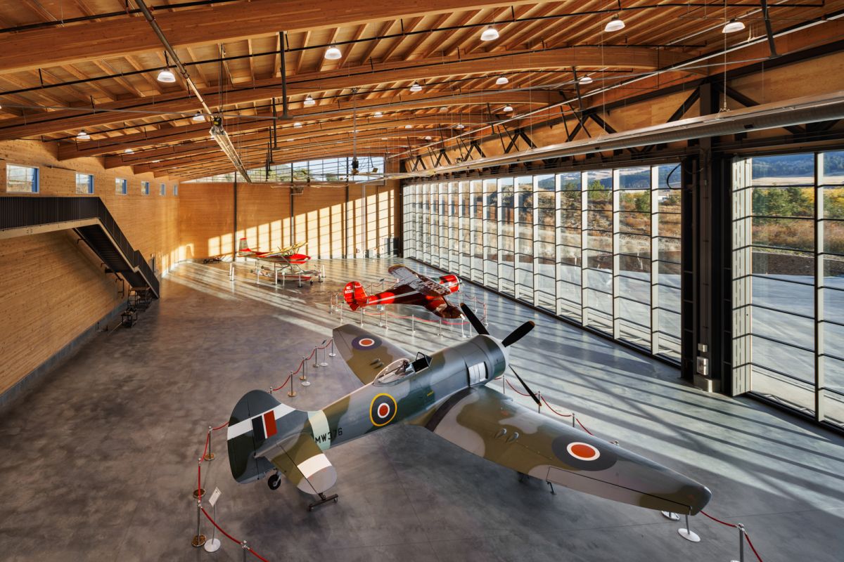 Architectural interior photograph by Shawn Talbot of KF Centre for Excellence in Kelowna, BC with multiple planes in a hangar built by Structurecraft