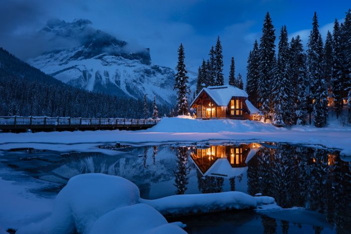 Emerald Lake Resort in BC Rockies at dusk across reflective pond