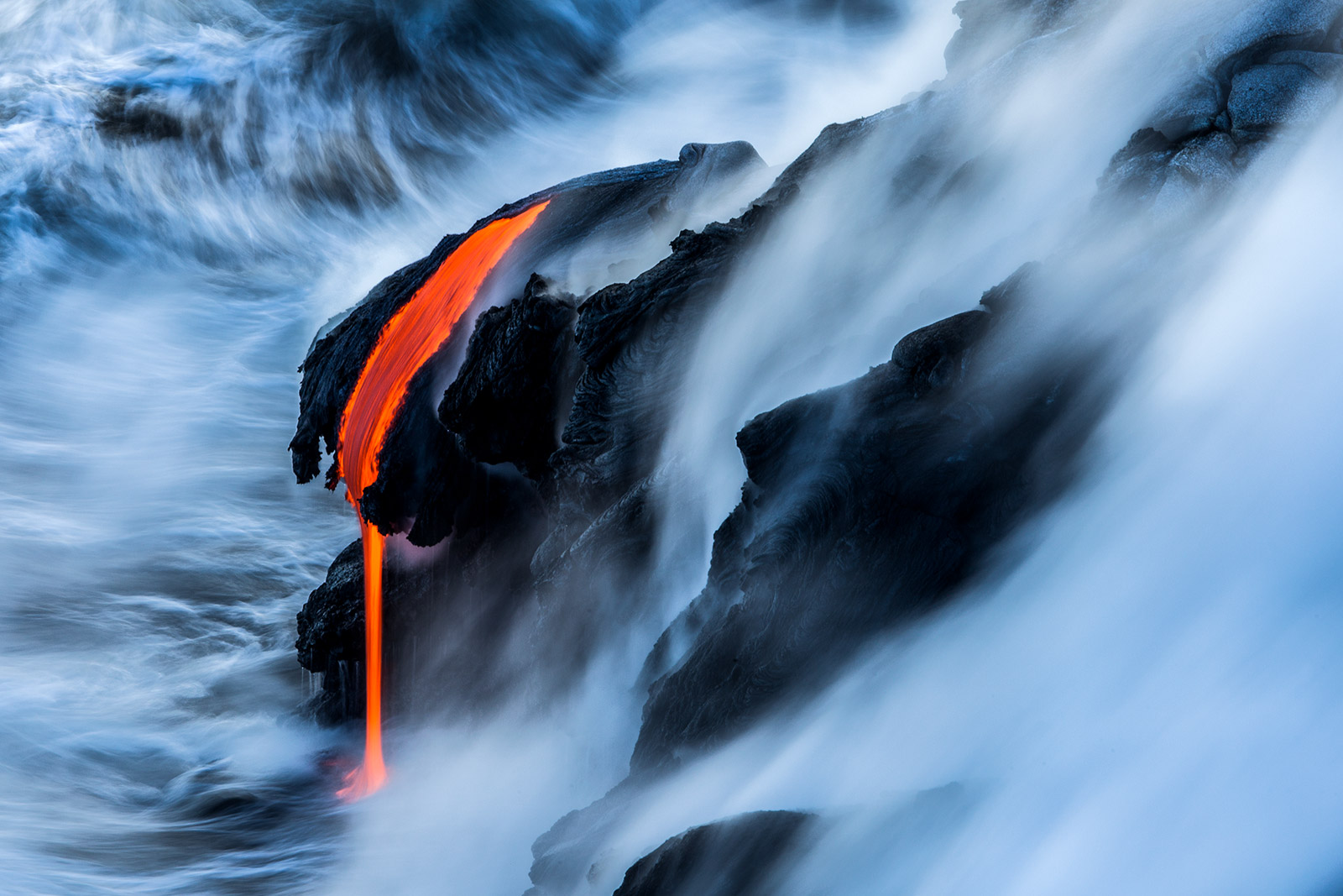 Hawaiin lava flow into ocean photograph