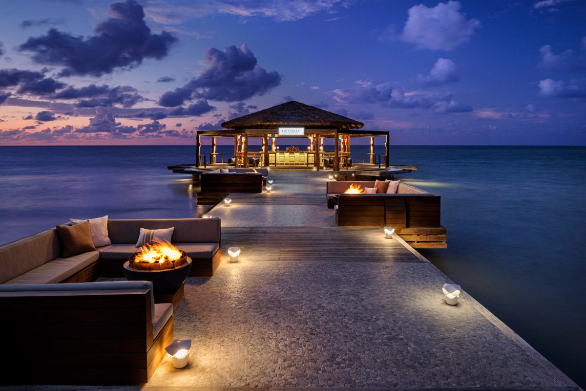 Sandals Montego Bay overwater bar restaurant Latitudes at dusk on the Caribbean sea