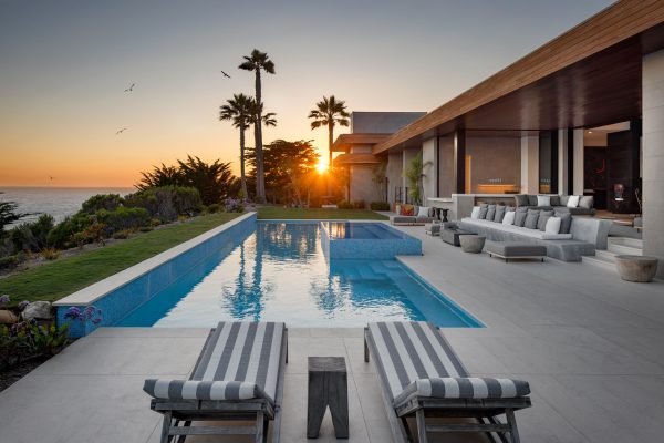 Sunset over a pool at a luxury mansion in Malibu
